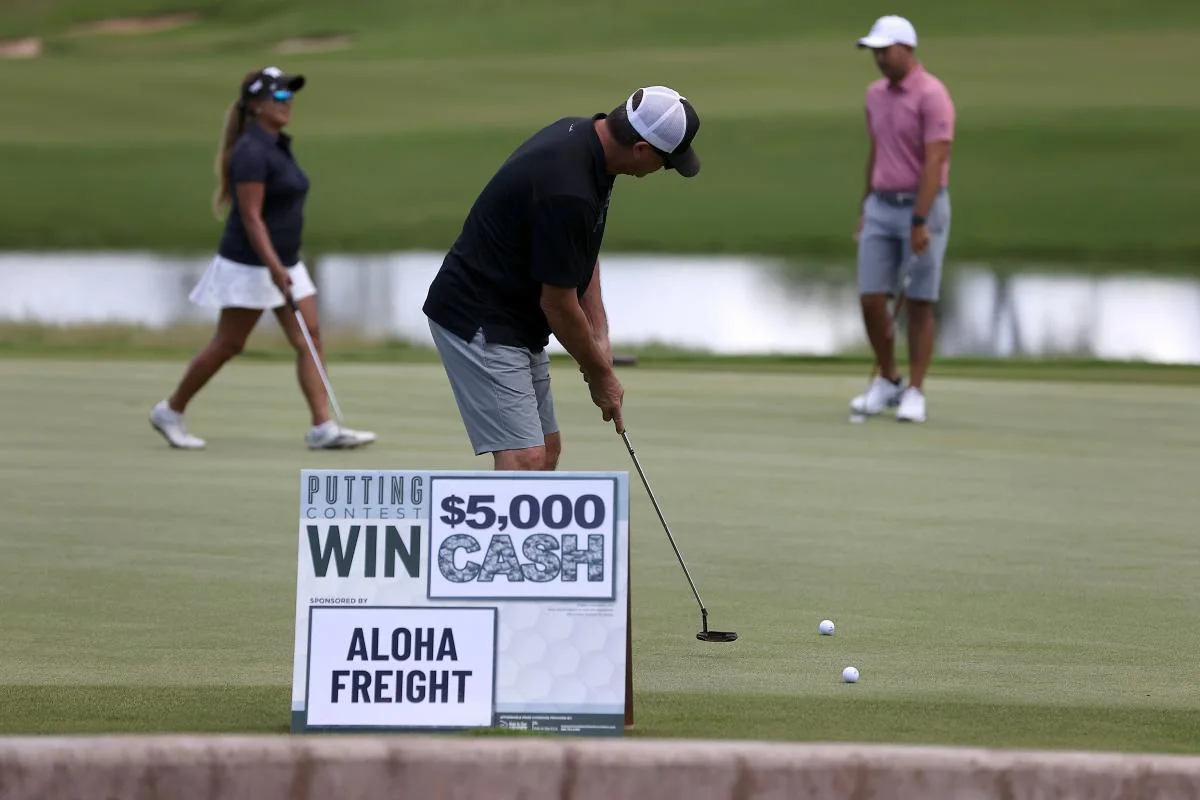 Golfer taking part in the tournament putting contest