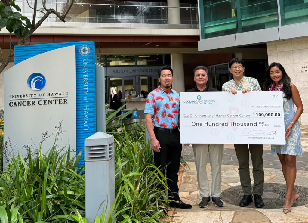 Cooling Cancer community presenting a donation to support cancer research in 2023