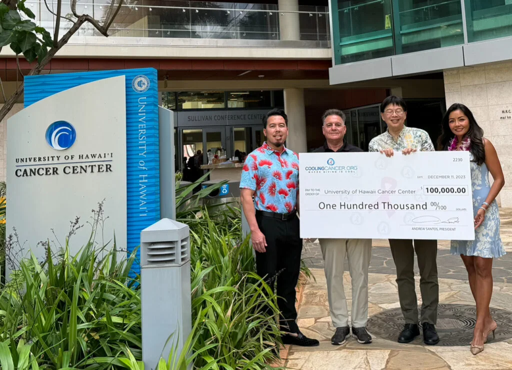 Cooling Cancer community presenting a donation to support cancer research in 2023