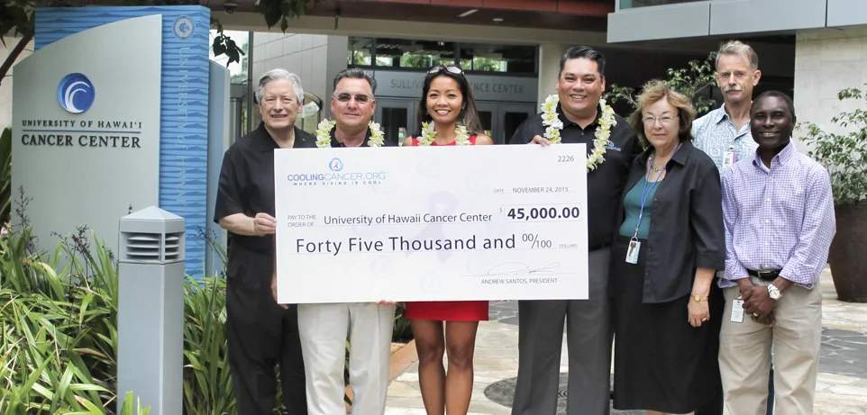 Cooling Cancer presenting a $45,000 donation to the University of Hawaiʻi Cancer Center in 2015